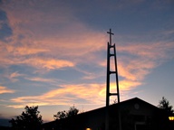Sunset behind Church steeple photo thumbnail